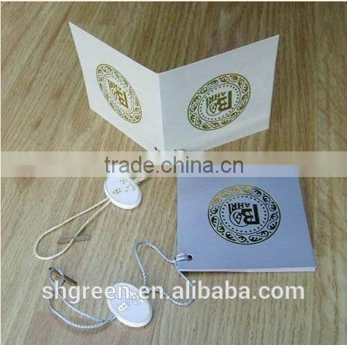 Center fold paper hangtag with plastic string tags for jeans denim