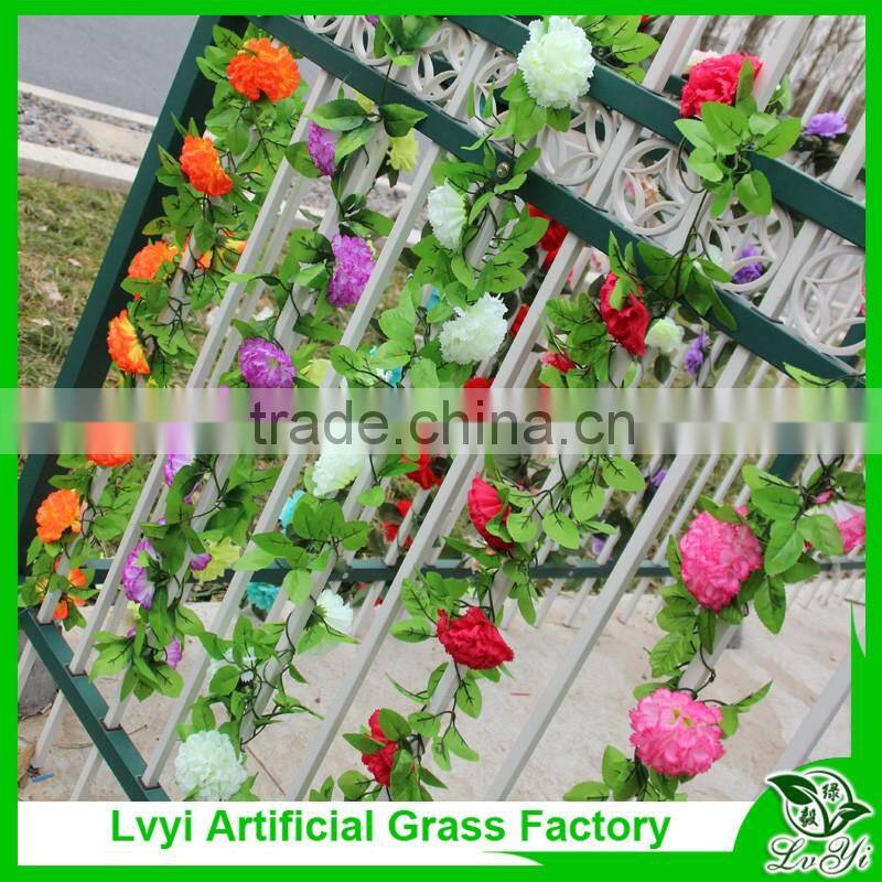Artificial green leaf vine with flowers for decoration