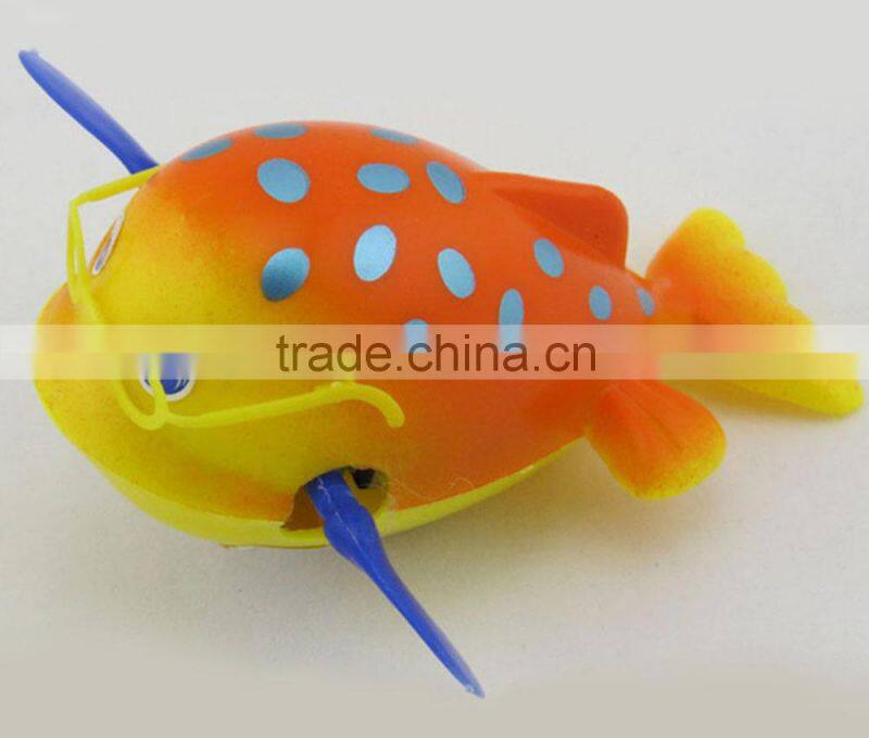 Cartoon fish clockwork toy with glasses