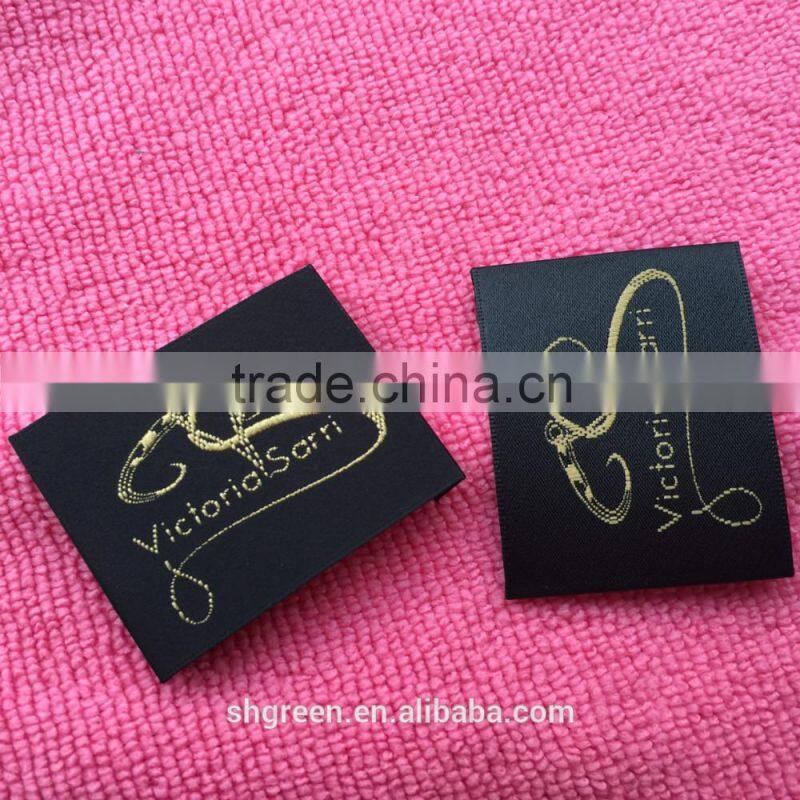 soft white satin woven label with silver metallic logo