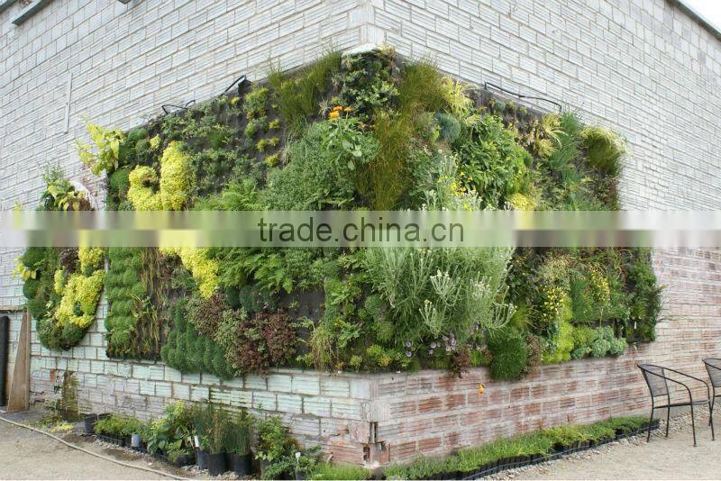 artificial plant wall with leaves/flowers/grass