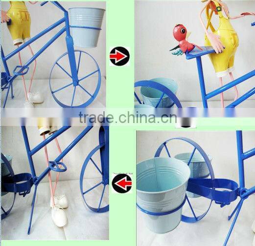 Metal Doll With Flower Pots