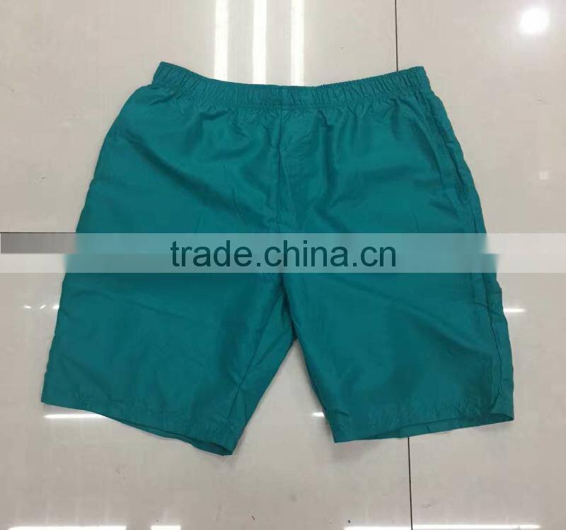 China stocklots men 100%polyester pure color bermuda shorts
