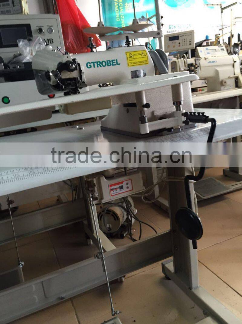 Universal blind stitch sewing machine with skip stitch device and spring-loaded rib shaft for thick fabrics