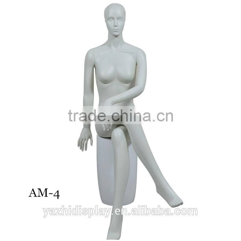 Abstract sexy headless female sitting mannequin for window display