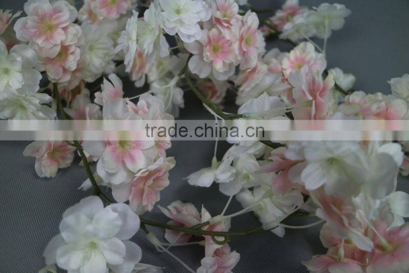 Artificial colourful cherry blossom garland for window display