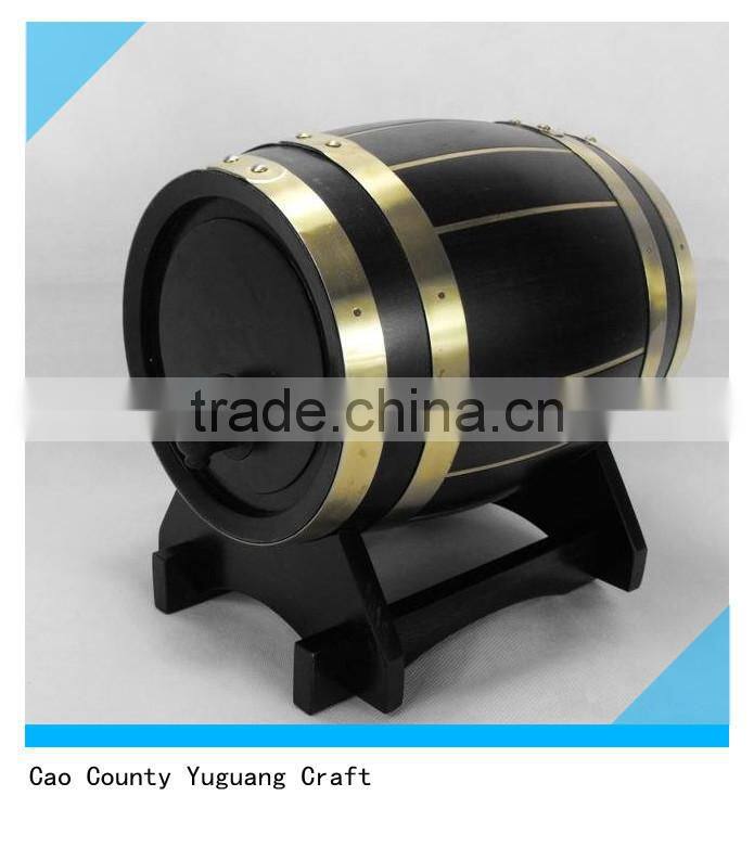 black wooden wine bucket with tap and wooden base
