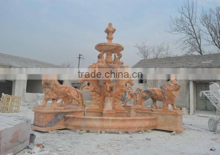 Large pink marble water fountain with poseidon and horses