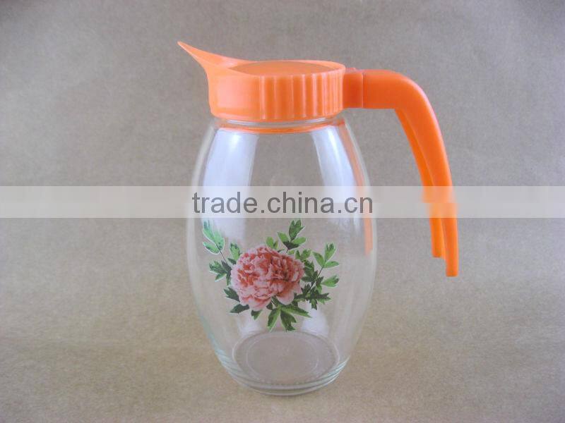 clear round glass water jug with plastic lids and handles