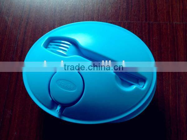 plastic round salad bowl with fork