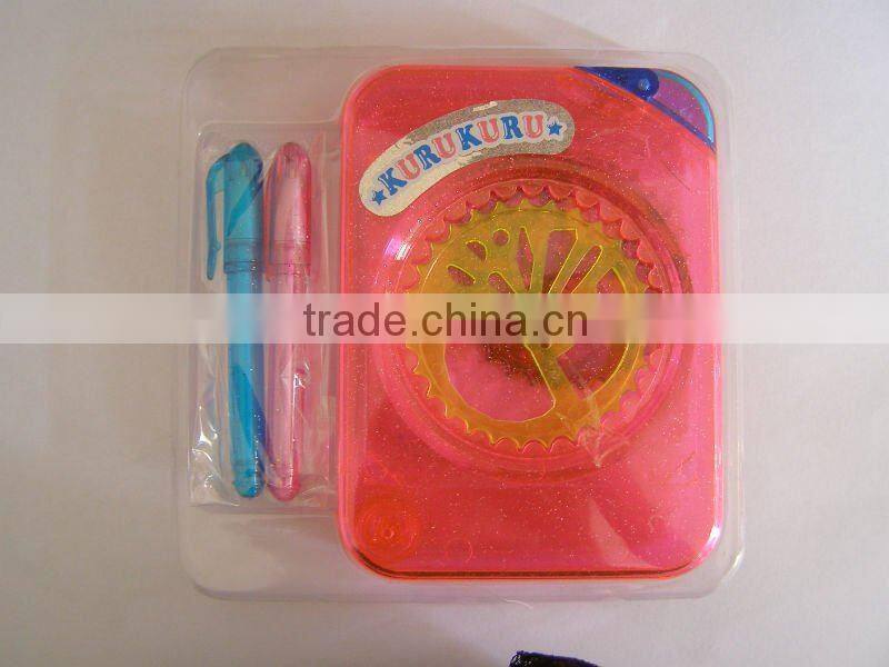 plastic spirograph toys with papers