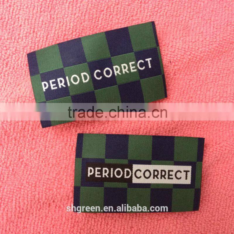 soft white satin woven label with silver metallic logo