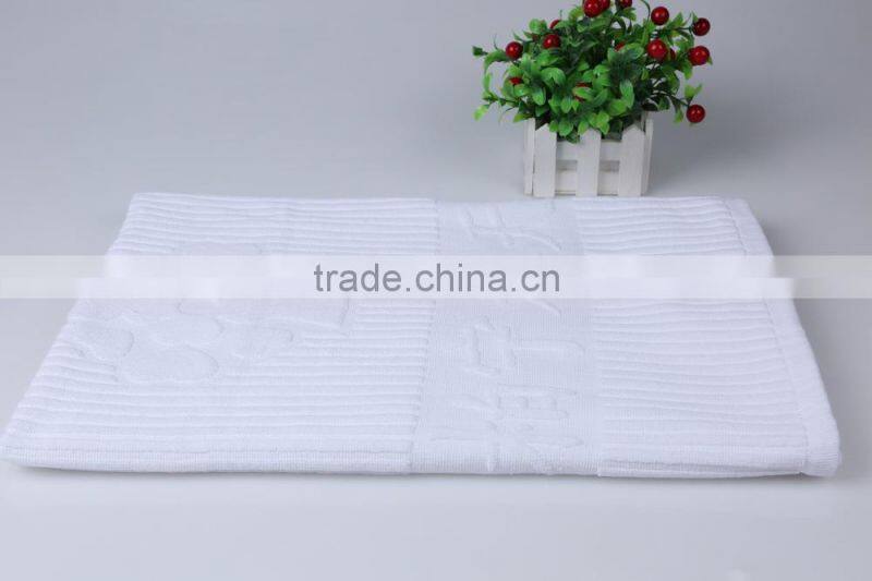 piece dyed solid color jacquard hotel bath mat embossed logo
