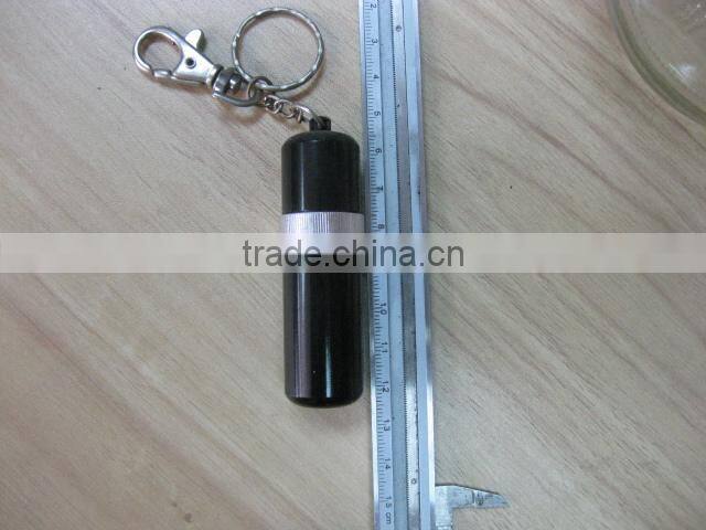 pill holder keychain with a pen