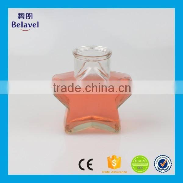 Hot sale star shape wedding decoration clear glass mini bottle