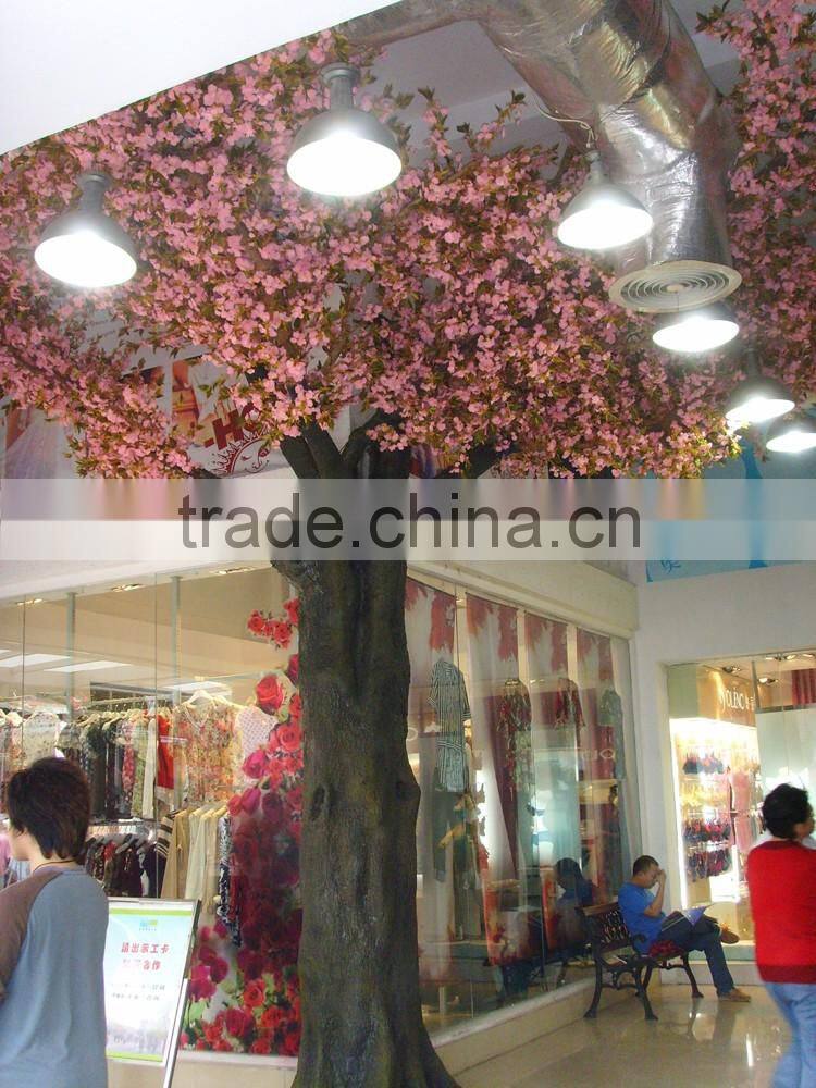 Pink artificial cherry blossom trees with rotating base