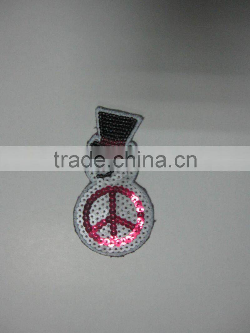 machine embroidered sequin badge design