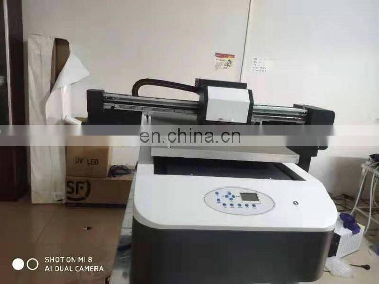Hot sale Economical 6090 UV flatbed printer (with 2pcs xp600 head , Photoprint ,CMYKLcLm W,1pc uv led lamp )