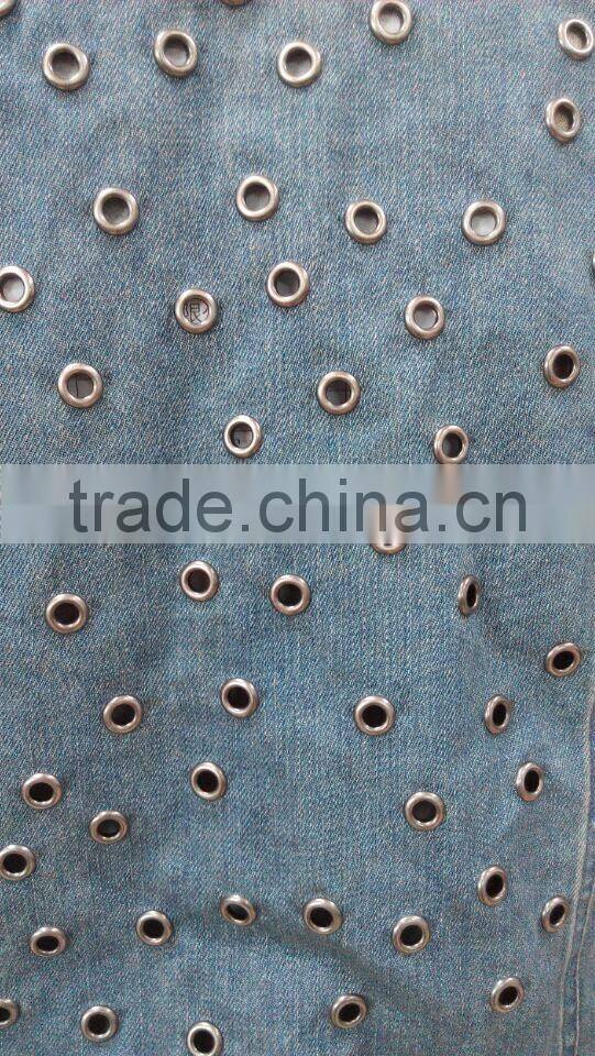 Ladies denim jacket with full metal eyelet on back