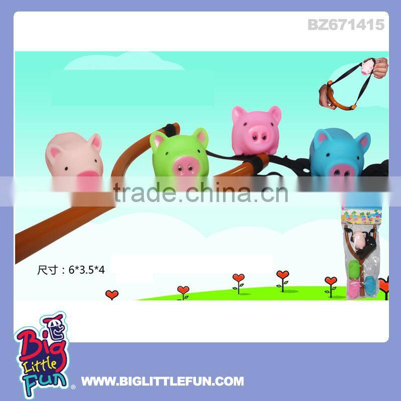 Plastic slingshot toy pig