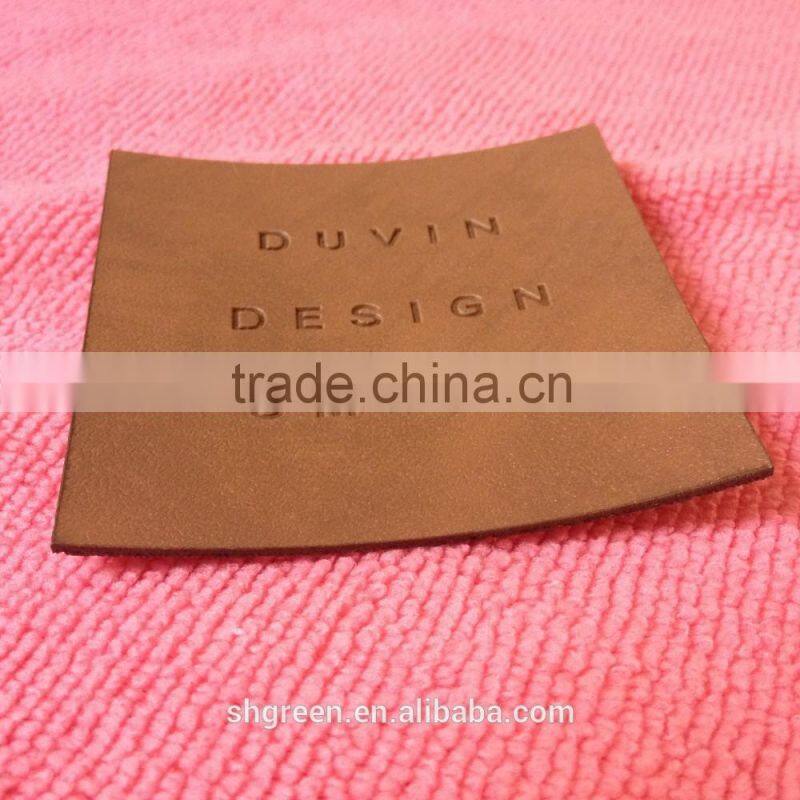 Soft debossed company name leather tags for suits