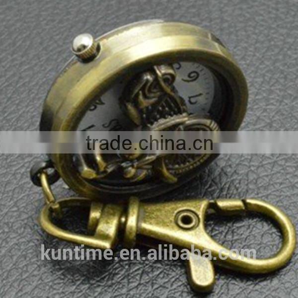 Bronze vintage watch with keychain decorate with motorbike