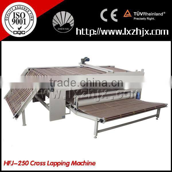 Nonwoven web layer cross lapping machine