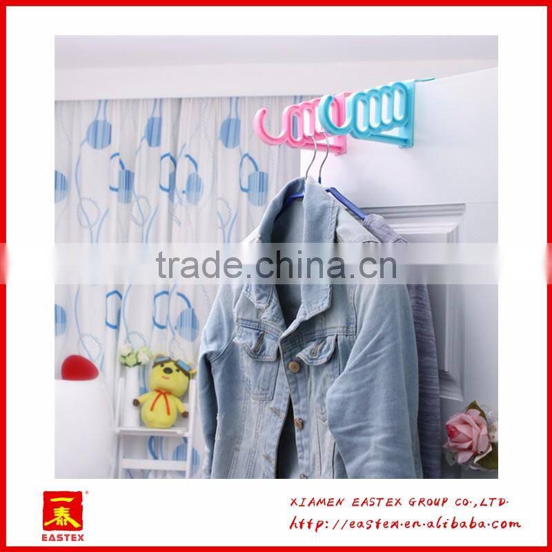 Multipurposed pothook behind the door