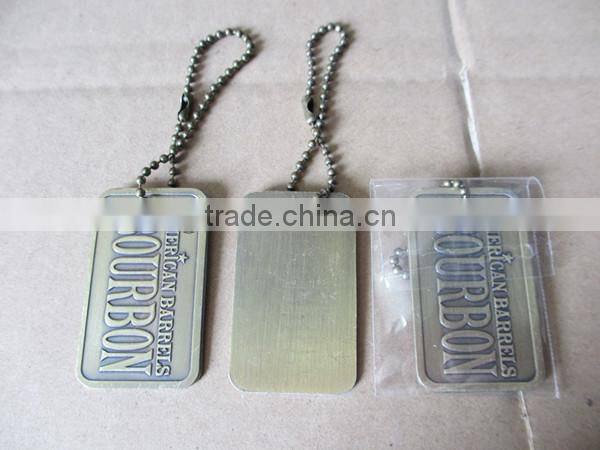 custom Iron tag with epoxy dome on top