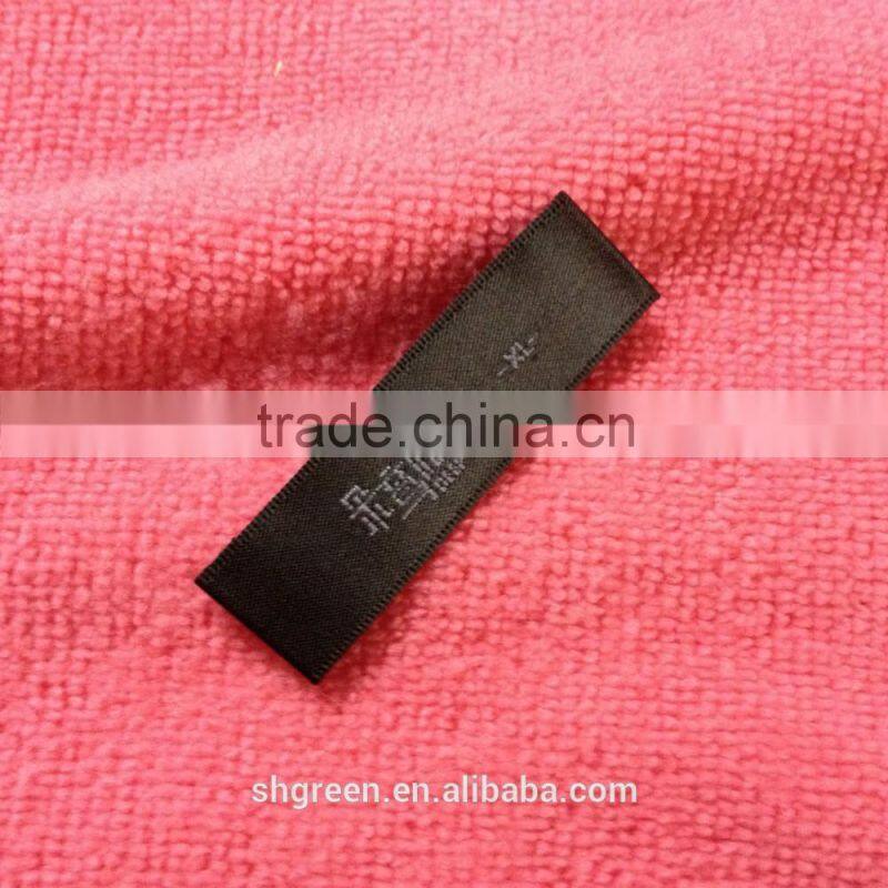 Wood spindle satin weaving label