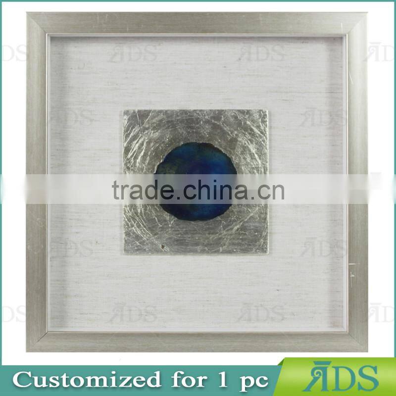 Box photo frames with mottled silver background encasing natural agate under glass