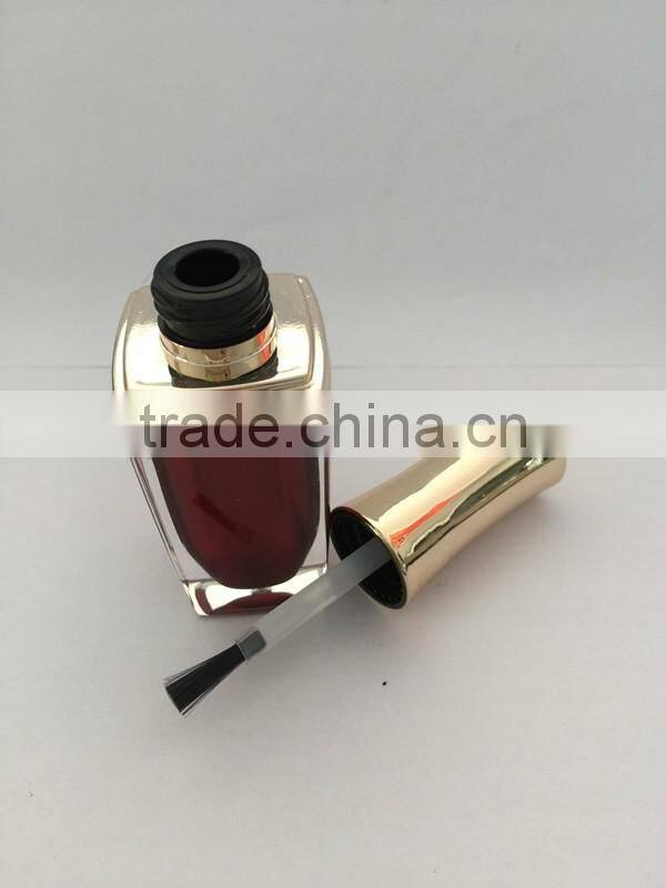 Red painted nail polish bottle with UV cap and shoulders