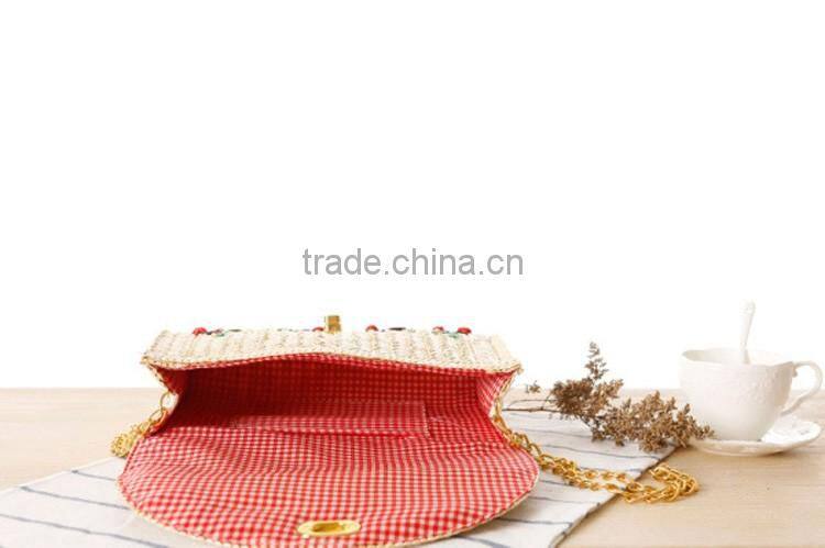 straw clutch bag with cherry pattern, gold chain cross body