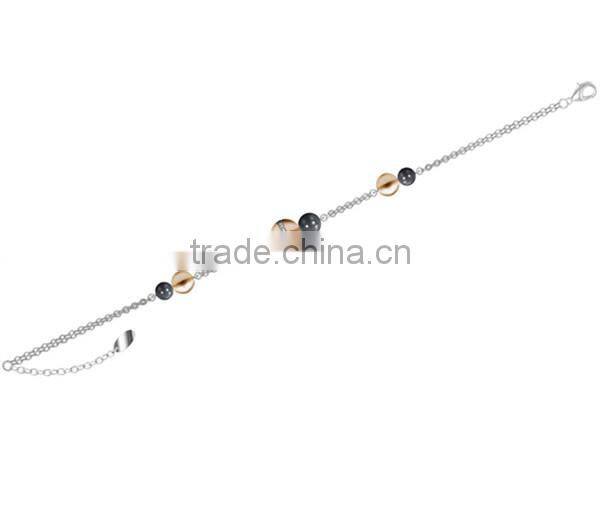 Women stainless steel chain bracelet with black and gold beads