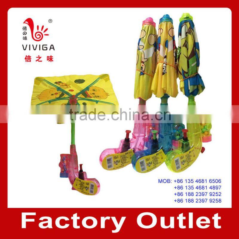 toy candy with water gun and umbrella