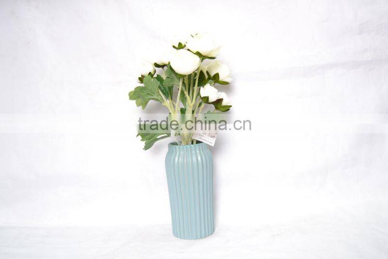 Elegant artificial Rose planted in ceramic pot for decoration