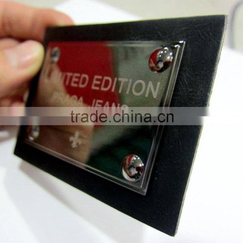 Embossed logo leather label for jeans
