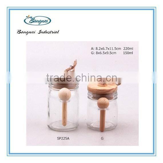 glass spice jar with wooden lid and spoon