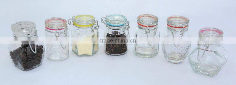 glass spice jar with colored ceramic folding top lid