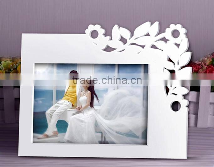 White carved wooden photo frame