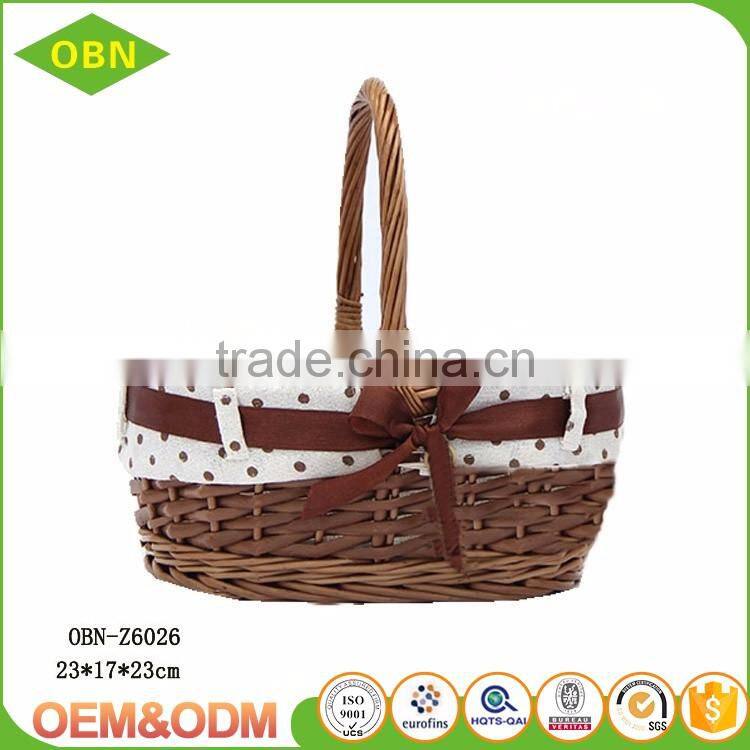 Unique vintage handled handmade wicker Christmas gift basket empty with ribbon