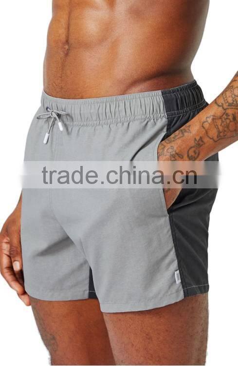Fashion Spliced Colorblock Swim Trunks Skinny Fitness Swim Shorts 12 Inch Side Seam Length 22 inch Leg Opening Mens Board Shorts