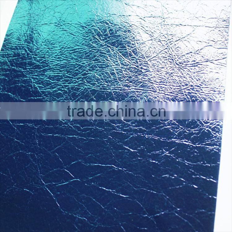 PU faux leather with scratch patterns ans shiny surface