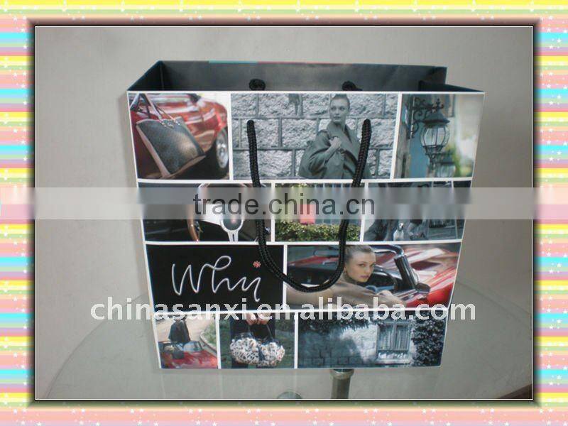 quality designer printed paper carrier bag with silver stamping logo