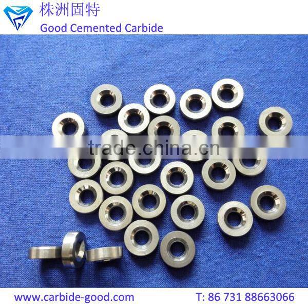 Discharge valve seat made from tungsten carbide