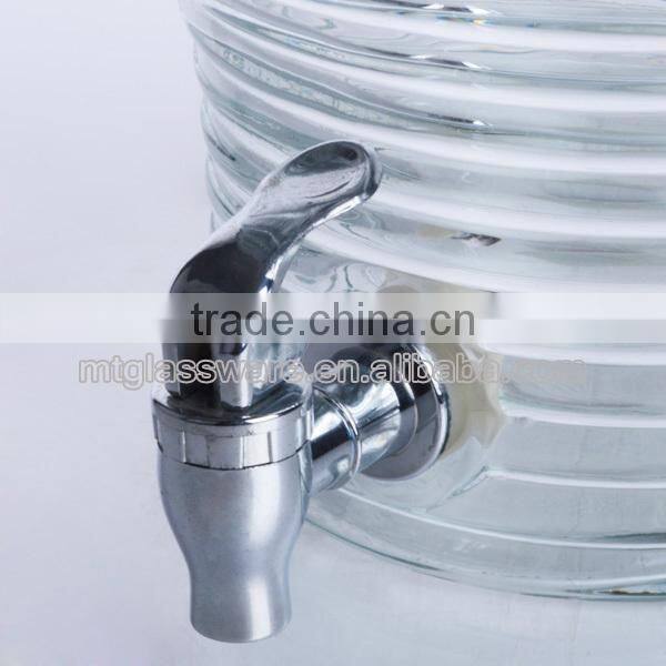 Clear machine made glass dispenser for juice beverage water with silver tap