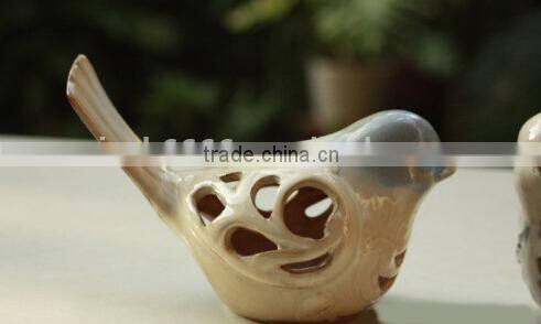 Ceramic bird home decoration with hollowed out shape