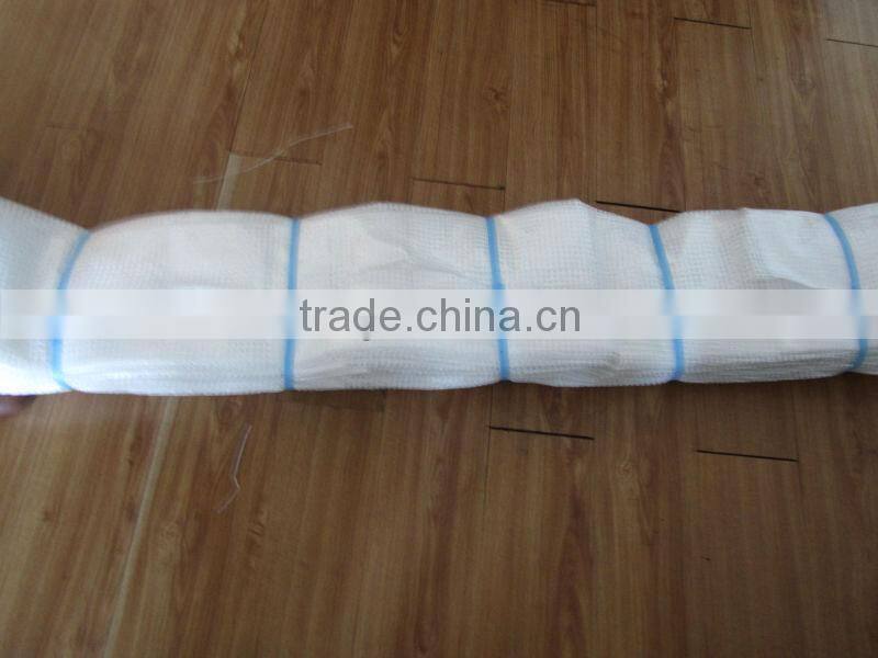 Strong clear or green mesh tarpaulin sheet used for building trade
