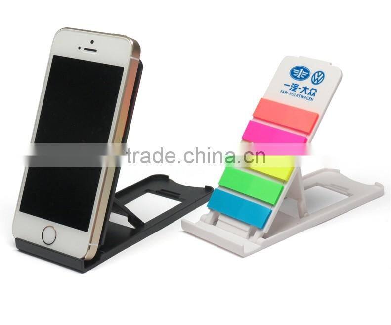 Multifunctional sticker with pen/mobile phone holder