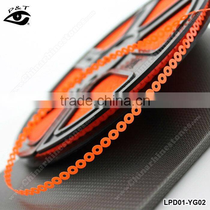 Fluorescent neon orange pet sequin reel for garment